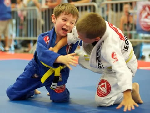 two boys in a wrestling ring