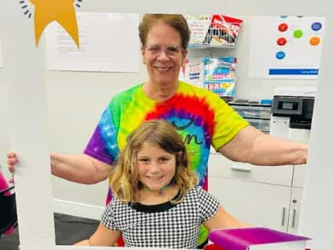 a person and a girl posing for a picture