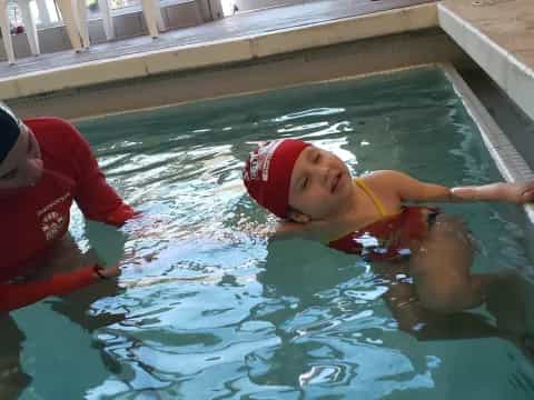 two kids in a pool