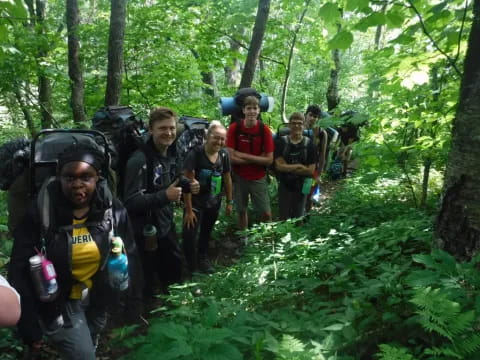 a group of people in the woods