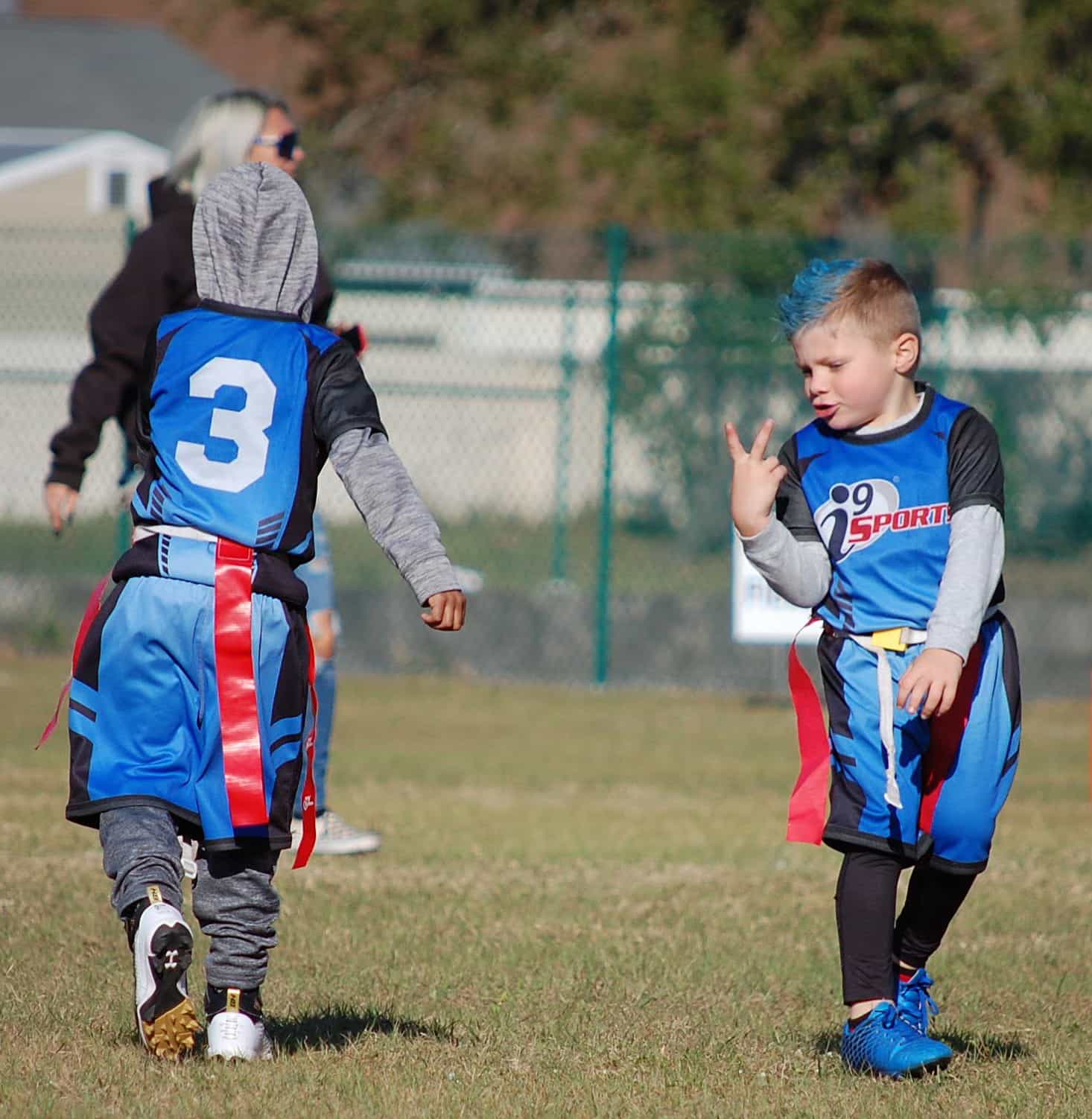 a couple of young boys playing football