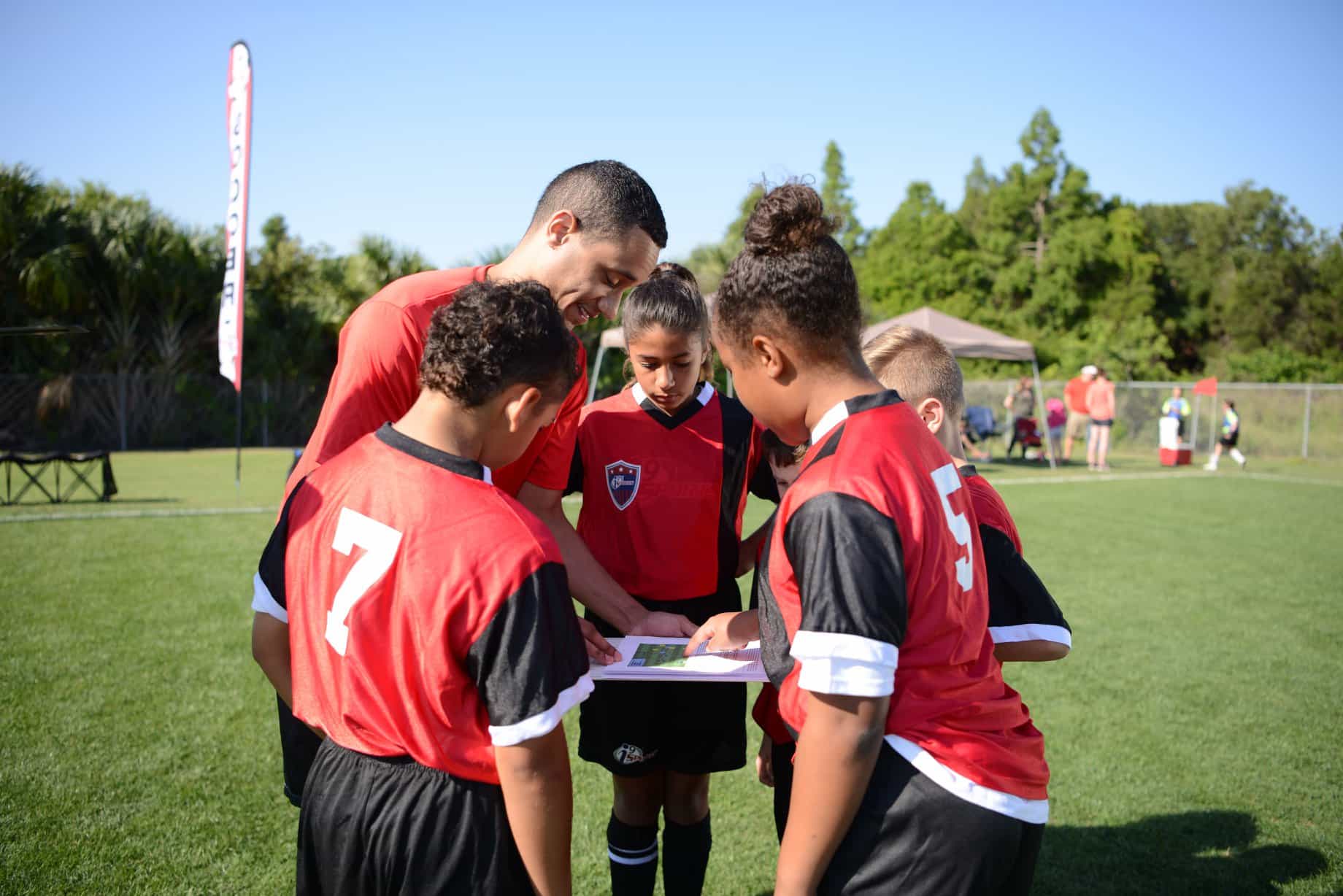a group of men in red uniforms