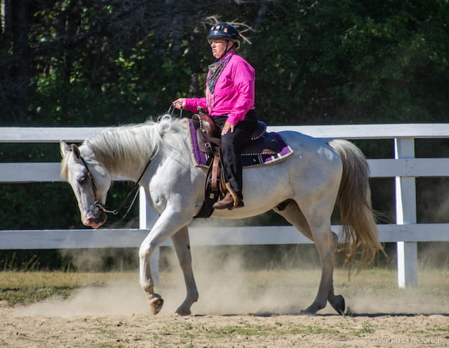 a girl riding a horse