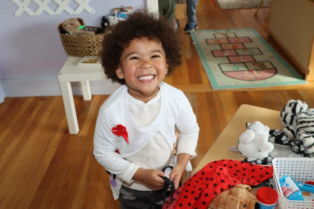 a child smiling at the camera