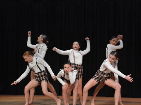 a group of people dancing on a stage