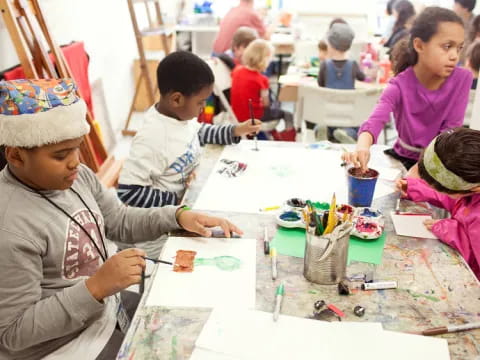 a group of children painting