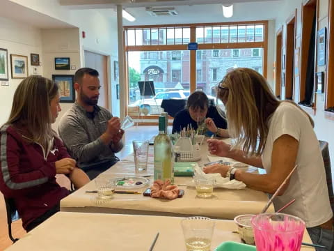 a group of people sitting around a table