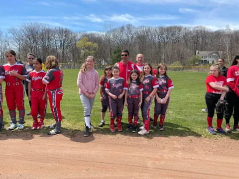 a group of people in red uniforms