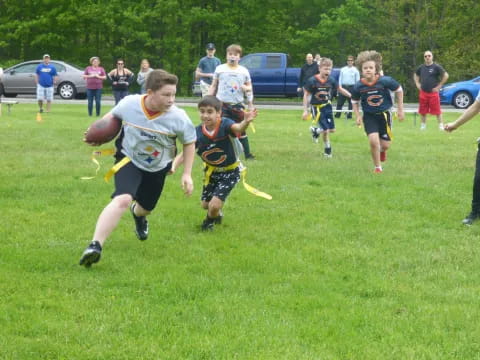 a group of kids playing with a frisbee