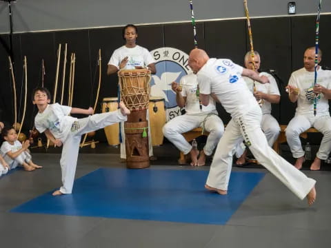 a group of people in karate uniforms