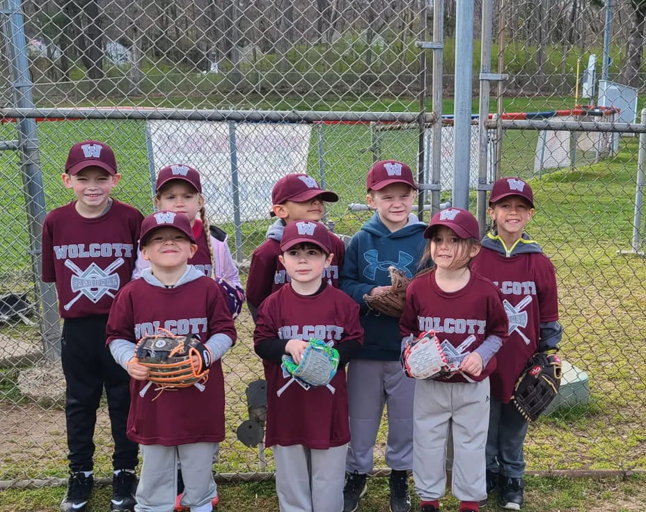 a group of kids pose for a picture