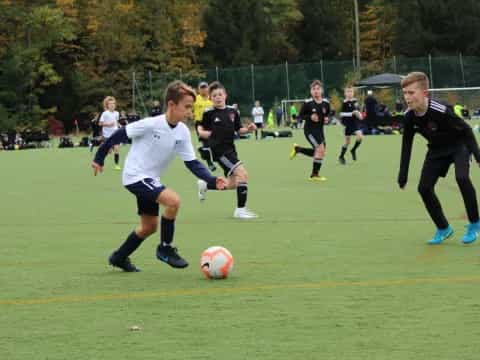 a group of kids playing football