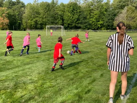 a group of kids playing football