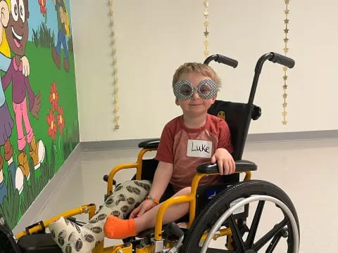 a boy in a wheelchair