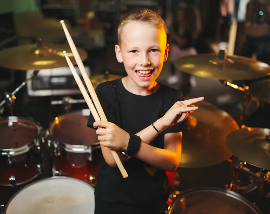 a boy playing drums