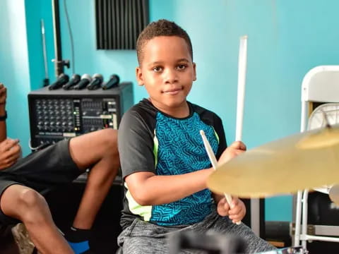 a boy sitting in a chair