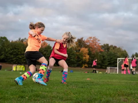 a couple of girls playing football