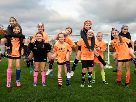 a group of girls in sports uniforms