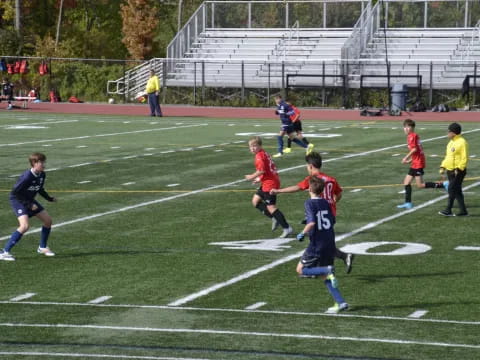 a group of kids playing football