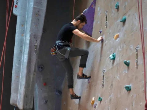 a person climbing a rock wall