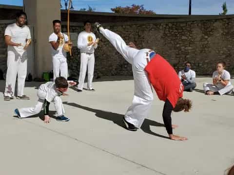 a group of people practicing martial arts