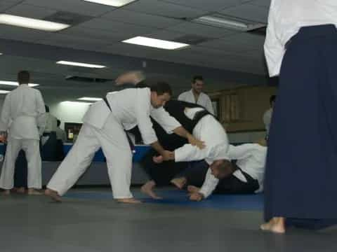 a group of people in karate uniforms