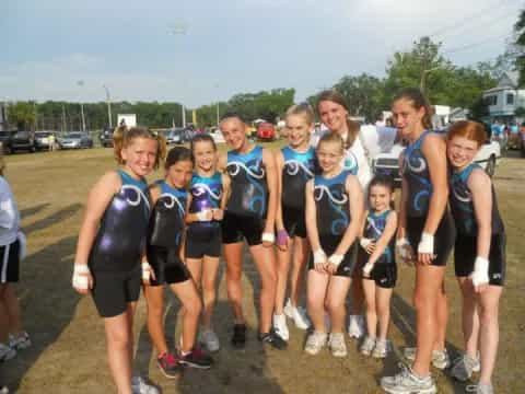 a group of girls in athletic wear