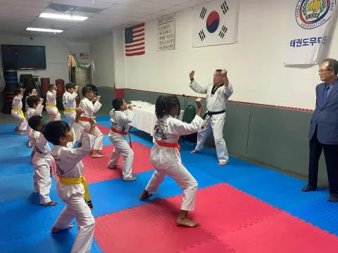 a group of children in a karate class