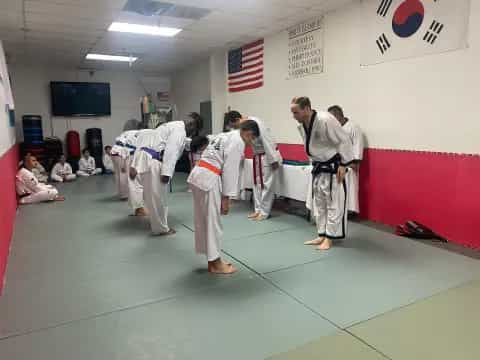 a group of people in karate uniforms