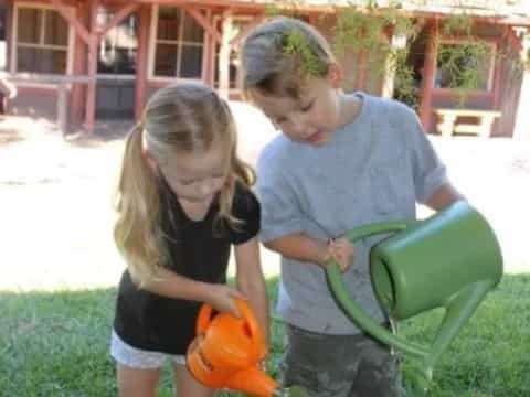 a couple of kids playing with a toy