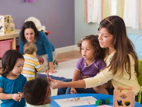 a person and several children in a classroom