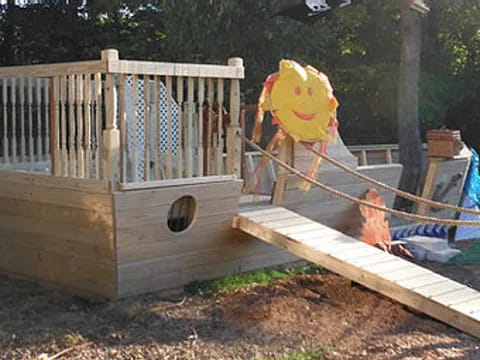 a wooden structure with a slide