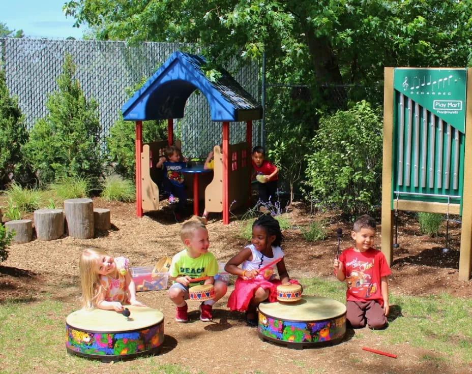children sitting in a play area