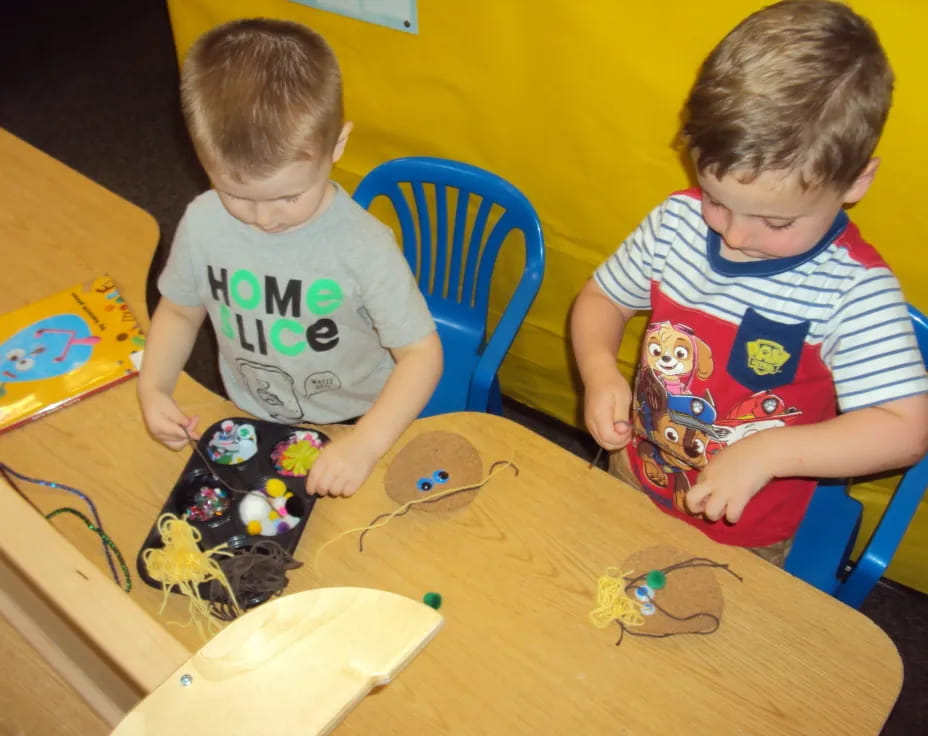 two boys playing with toys