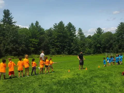 a group of kids playing football