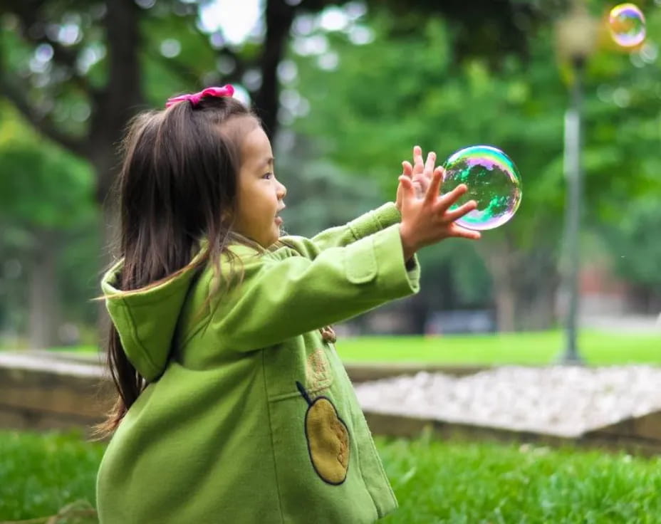 a girl holding a frisbee