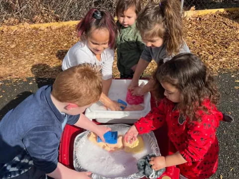 a group of children playing with a toy