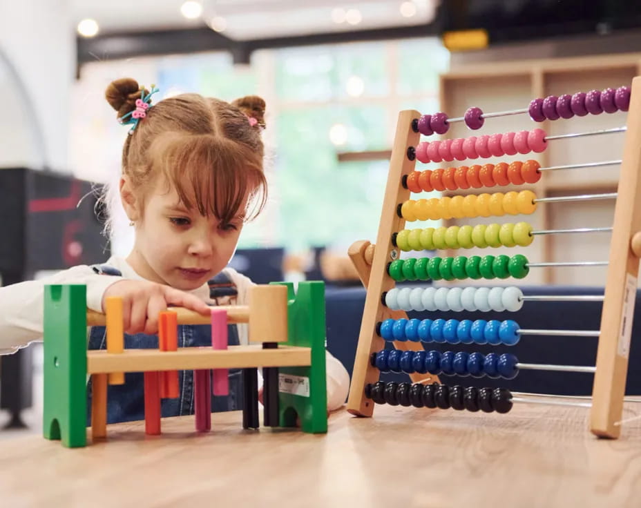 a girl playing with toys