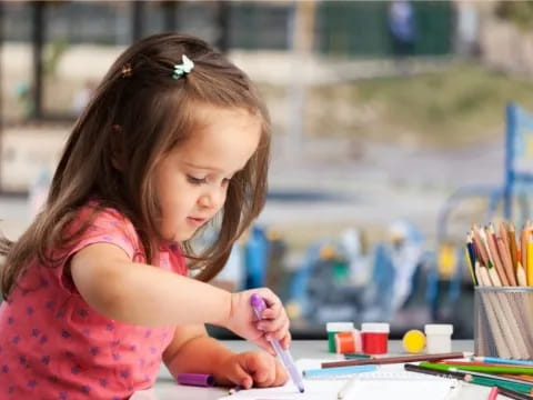 a young girl painting