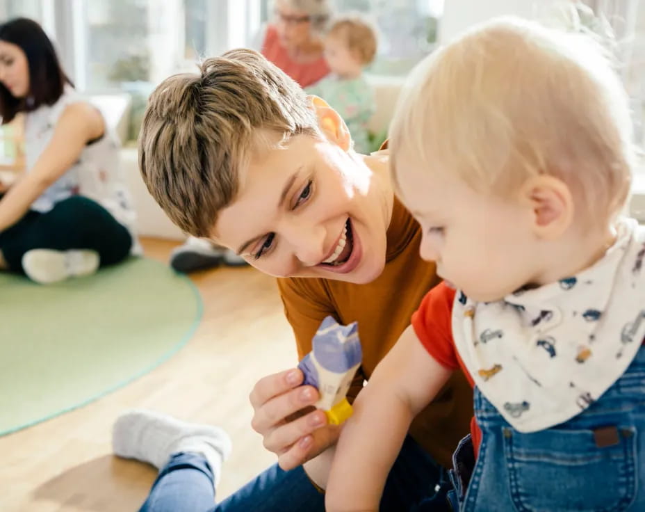 a couple of kids playing with a toy