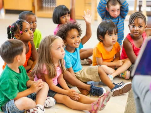 a group of children sitting on the floor