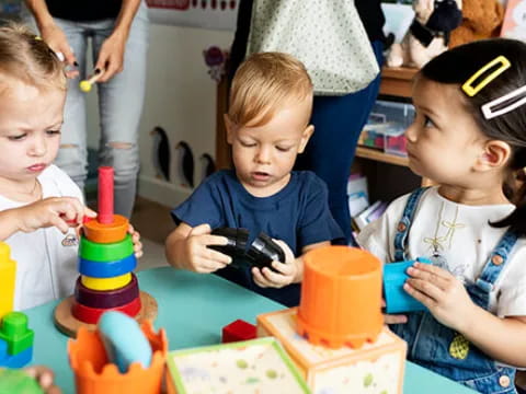 a group of children playing with toys