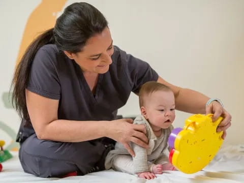 a person holding a baby