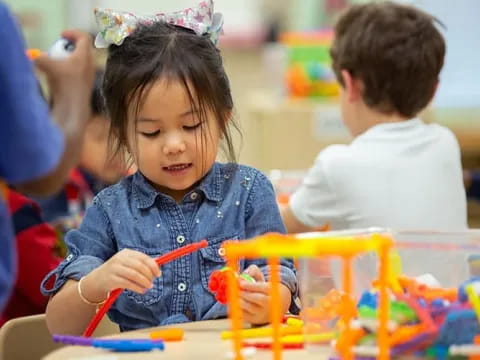 a young girl coloring on a paper