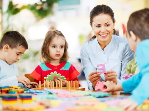 a person and children playing with a toy