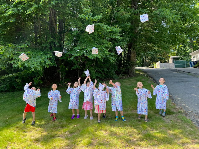 a group of children holding basketballs