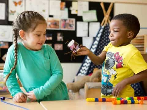 a couple of children playing with toys