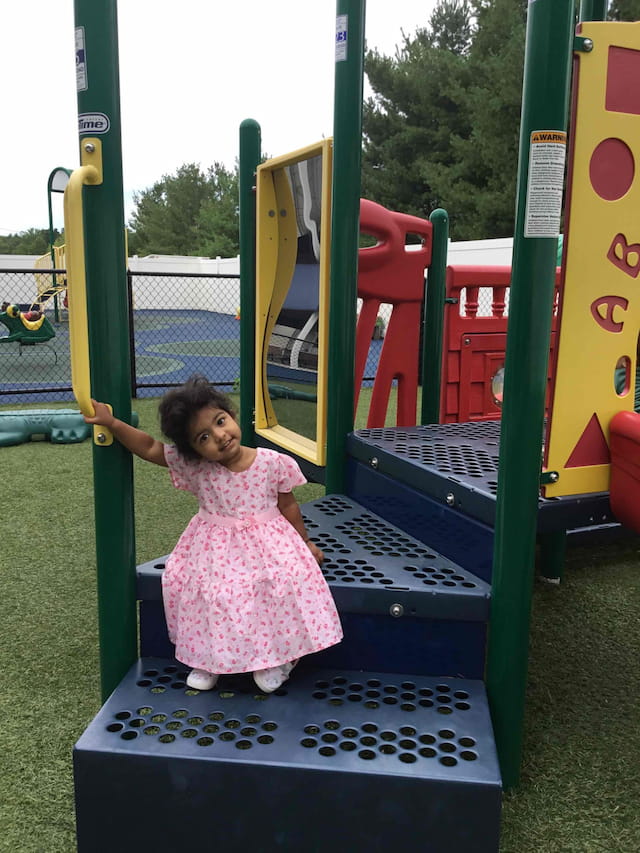 a baby on a playground toy