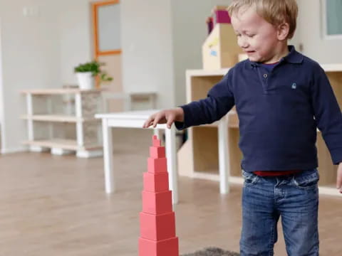 a boy playing with a toy