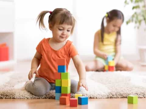 a couple of children playing with toys